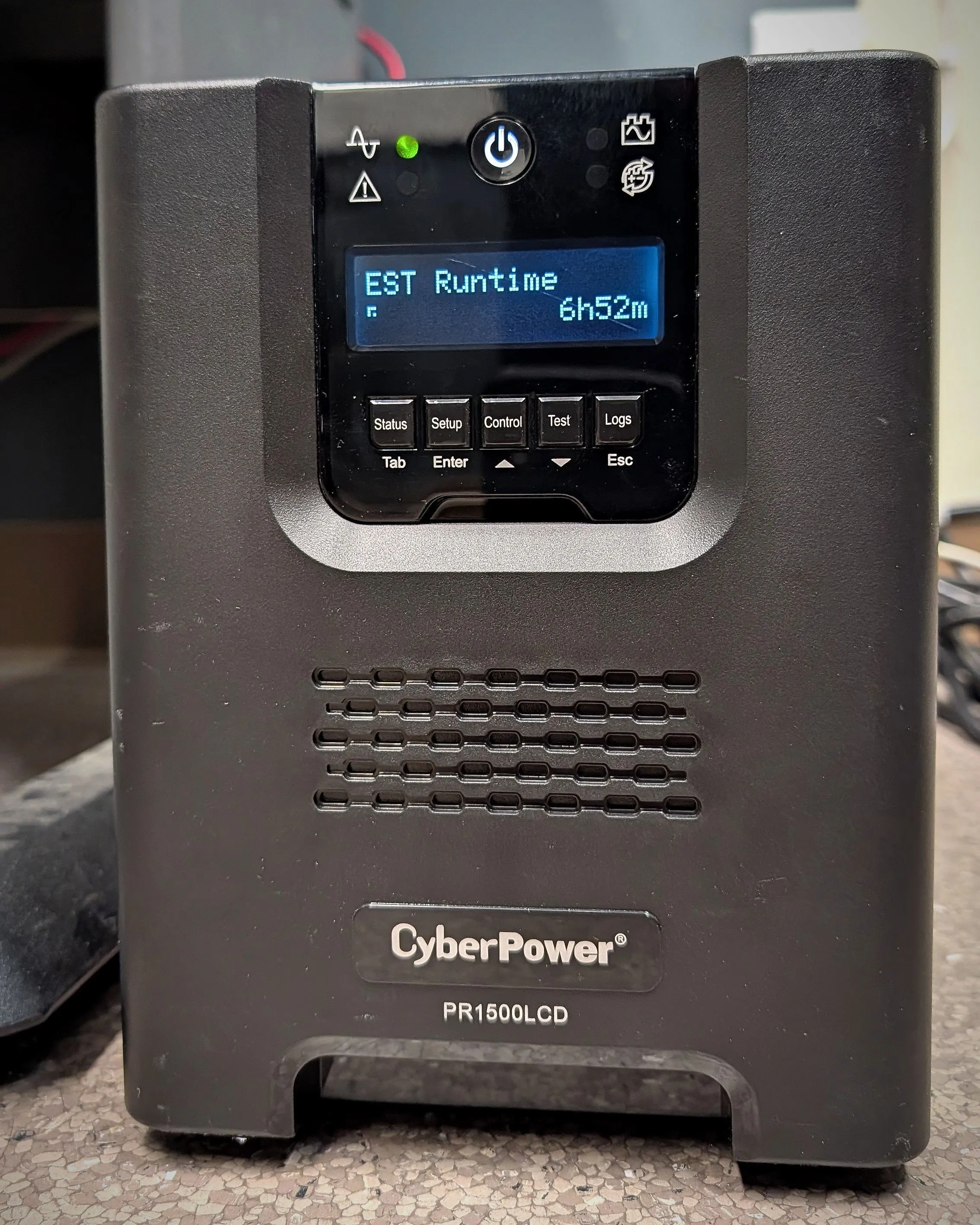 Tower UPS with its display showing an estimated battery runtime